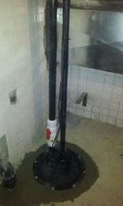 Sewage pump installation in basement